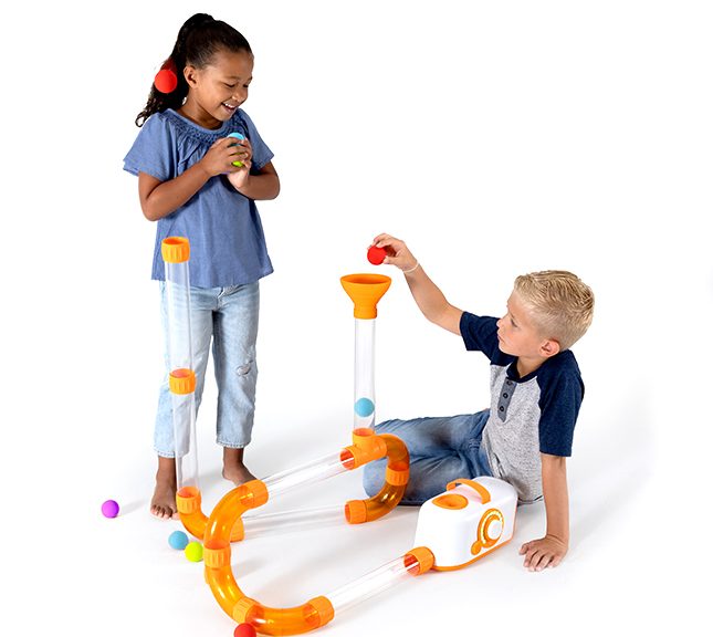 toddler lining up toys